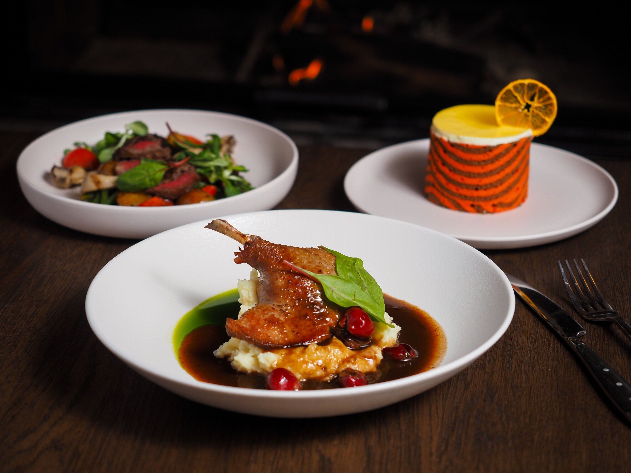 Three plated courses at the table